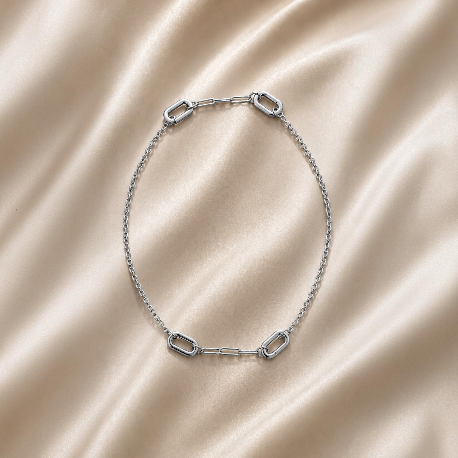 HOUSE OF EVEN Orbit Connector Necklace in polished silver stainless steel with three removable oval link connectors.